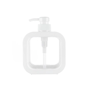 Close-up of a clear square plastic pump bottle for soap and lotion on white background