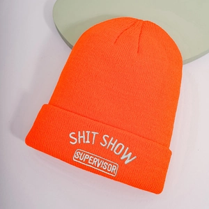 Detailed view of neon orange beanie with white Shit Show Supervisor embroidery