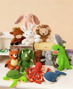 Detailed close-up showing textures of various hand-crocheted stuffed animal dolls