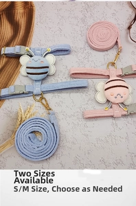 Detail view of adjustable bee-themed corduroy cat harness set in pink and blue