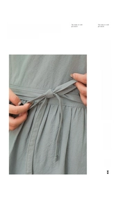 Detailed macro view of pure cotton apron waist featuring adjustable ties and fine texture