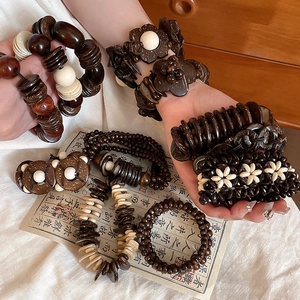 Vintage coconut shell and wood bead bracelets in assorted ethnic designs for women