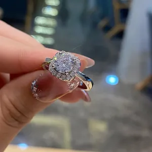 Close-up of a sparkling four-claw halo wedding ring with micro-pave diamonds for women