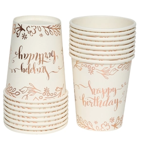 Close-up of rose gold foil happy birthday lettering on cream white paper cups