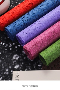 Macro view of colorful premium textured fiber paper rolls for florist bouquet wrapping