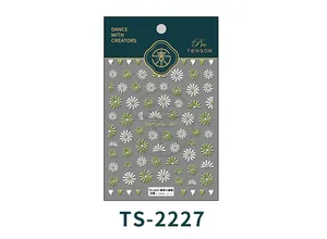 Macro detail of 5D embossed daisy flower nail art stickers in white and green motifs