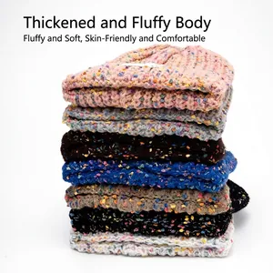 Thick knitted beanie with colorful speckles and warm ear protection for women