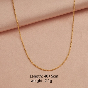 Detail view of 18k gold plated chain with length 40+5cm and weight 2.1g on pink silk