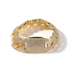 Detailed close-up of 20mm golden Cuban link bracelet with pavé-set shimmering cubic zirconia