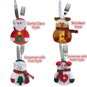 Christmas silverware holders featuring Santa, reindeer, and snowman designs for festive tables