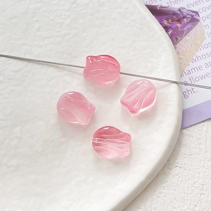 Macro shot of pink gradient glass tulip beads for DIY jewelry making and necklaces
