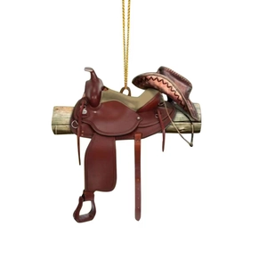Detail of miniature western saddle and cowboy hat pendant with golden hanging cord