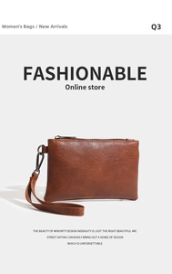 Detailed macro view of the brown litchi grain texture and metal zipper on the unisex pouch