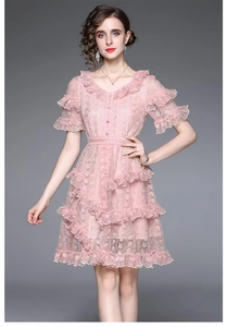 Detailed view of pink lace V-neck dress with ruffle sleeves and elegant waist design