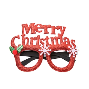 Sparkly red Merry Christmas party glasses with snowflakes and holly on white background