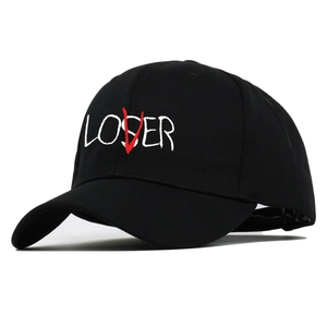 Black cotton baseball cap with white LOSER text and red V embroidery in a minimalist style