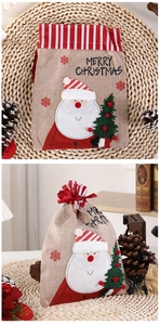 Detail of Christmas burlap drawstring bag with Santa Claus applique and plaid trim