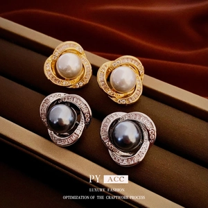 Elegant pearl earrings with sparkling cubic zirconia twist design in gold and silver finish
