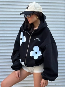 Oversized black zip-up hoodie with white floral print and drop shoulder loose fit style