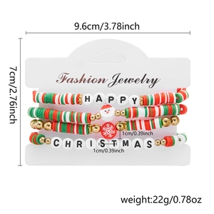 Detail of Christmas beaded bracelet set with Santa pendants and festive happy charms