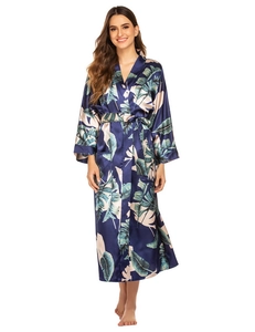 Detailed view of dark blue silk satin robe with elegant palm leaf floral print textures