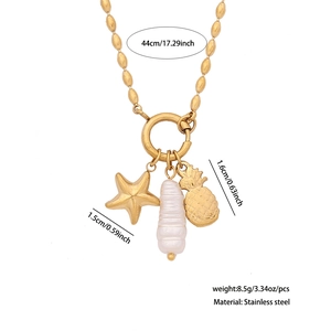 Detailed view of stainless steel necklace with starfish, pearl, and pineapple pendants