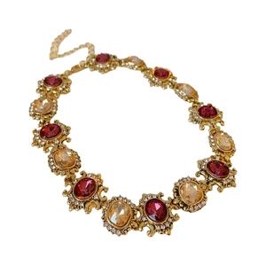 Vintage gold necklace with red and champagne crystals in a luxury palace style