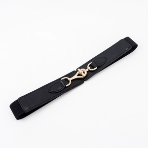 Close-up of black elastic waist belt with a golden interlocking horsebit buckle