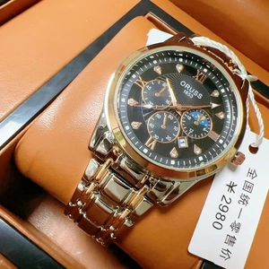 Detail of luxury men's steel watch with black dial and luminous gold roman numerals