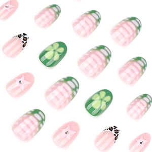Short round press on nails with green floral and pink star patterns in fresh summer style