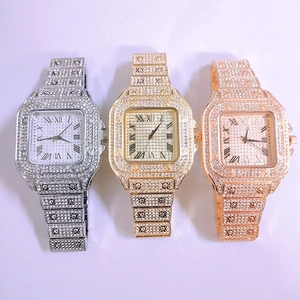 Detailed view of three luxury square quartz watches in silver, gold, and rose gold finishes