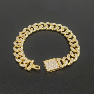 Macro shot of 12mm gold plated Cuban link chain with full rhinestone diamond pavé details