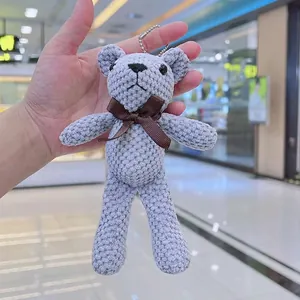 Portachiavi orsetto di peluche lavorato a maglia grigio con fiocco e catena a sfere
