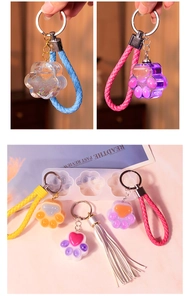 Detailed DIY cat paw silicone mold kit with colorful resin keychains and braided ropes