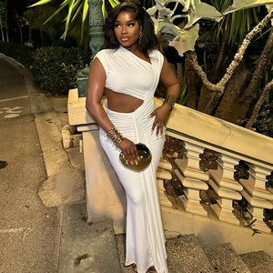 Elegant white one-shoulder maxi dress with cutout details and ruffled fishtail hem