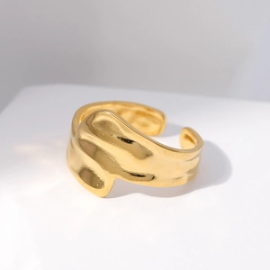 Irregular textured gold open ring made of durable stainless steel on a white background