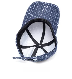 Detail view of denim baseball cap interior with sequins and black reinforcement straps