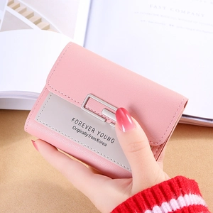 Pink faux leather tri-fold short wallet for women featuring metal decor and pebbled texture