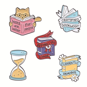 5-piece literary enamel pin set with cat reading books and author medals on white background