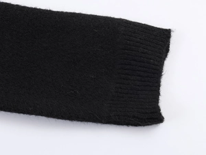 Macro shot of black ribbed knitted cuffs from the Christmas patterned casual lounge set