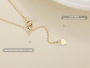 Detail of 18K gold plated S925 silver lobster clasp and adjustable sliding bead on chain