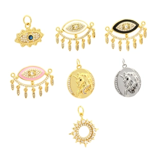 Gold and silver evil eye and unicorn pendants with cubic zirconia and enamel details