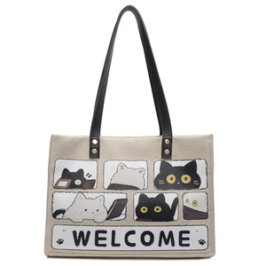 Cute beige canvas cat tote bag with black handles and six-panel comic illustrations
