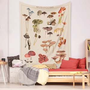 Detailed botanical mushroom tapestry hanging on a wall above a cozy sofa bed