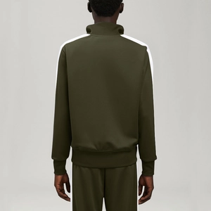 Back view of dark green tracksuit featuring stand collar and white contrast side stripes