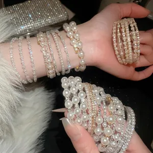 Double-layered pearl and diamond bracelet featuring elegant gold-plated craftsmanship