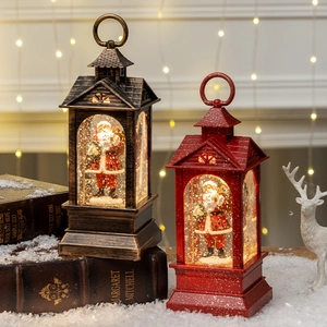 Christmas lantern music box with Santa figurines in bronze and red festive finishes