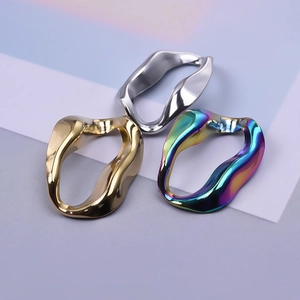 Irregular wave stainless steel rings in silver, gold, and rainbow metallic finishes