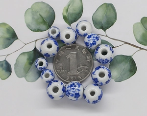 Blue and white porcelain ceramic beads size comparison with a one dollar coin