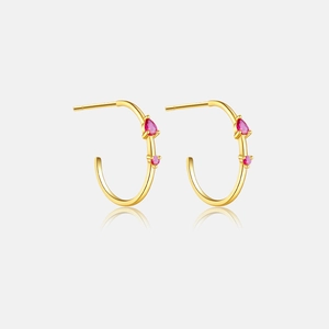 Detailed view of 925 silver gold-plated hoop earrings with rose red zircon stones